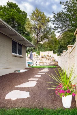 Waterfall In A Boulder Retaining Wall In Holladay Hills — Landscape Design project by Big Rock Landscaping in Salt Lake City