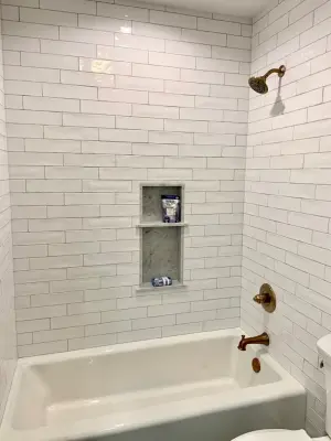 Renovation of the Guest Bathroom — Flooring Installation Services project by Benchmark Renovations