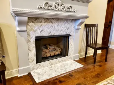 Kitchen Backsplash and Fireplace Trim — Flooring Installation Services project by Benchmark Renovations