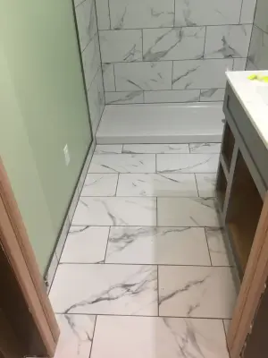 Installation of Marble Shower Tiles — Flooring Installation Services project by Merkel Tile