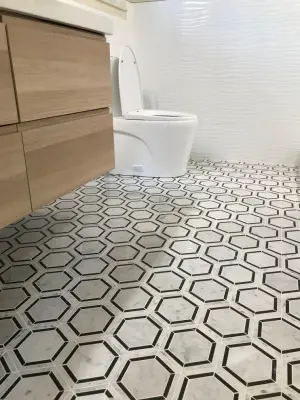 Contemporary Bathroom Renovation — Flooring Installation Services project by Benchmark Renovations