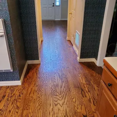 Refinishing a Pre-Finished Engineered Wood Floor — Flooring Installation Services project by Footprints Floors | McKinney