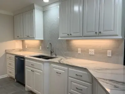 Textured Subway Tile Backsplash Setup — Flooring Installation Services project by Benchmark Renovations