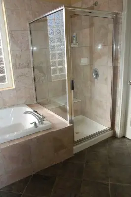 Tailored Tiled Bathrooms — Flooring Installation Services project by Footprints Floors | McKinney