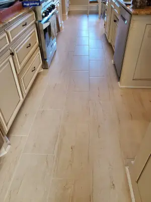 Ceramic tiles made from natural stone — Flooring Installation Services project by Footprints Floors | McKinney