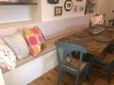 Vibrantly Decorated Breakfast Corner — Interior Design & Decorating project by High Cotton Interiors