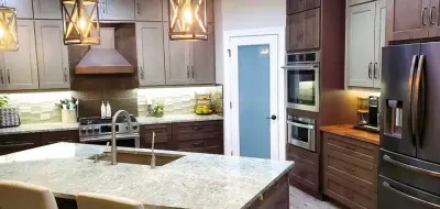 Rustic Modern Kitchen Renovation - Warm Taupe Cabinets and Textured Backsplash — Interior Design & Decorating project by Calming Spaces Interiors, Design & Remodeling