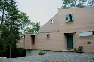 K2: distinctive lakeside cottage highlighted in Maine Home & Design magazine — Architectural & Building Design Services project by George Gekas Design