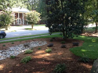 Holly Springs River Rock Creekbed - Drainage Mitigation — Landscape Construction project by DesignScapes Of North Carolina, Ltd. in Raleigh