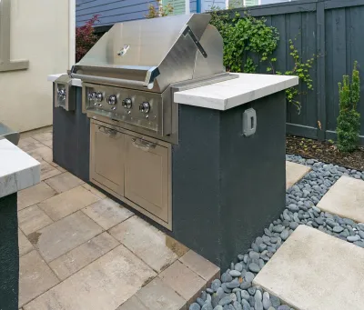 Family Gathering and Cooking Backyard by DPG Pavers And Design