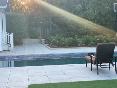 Backyard Porcelain Paver Pool Deck — Landscape Construction project by DPG Pavers And Design