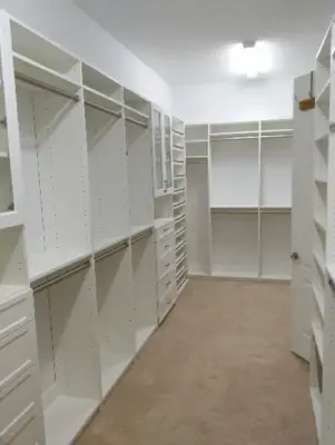 Optimal Storage Walk-In Closet by The Tailored Closet And PremierGarage