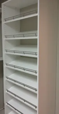 Ivory Walk-In Wardrobe by The Tailored Closet And PremierGarage
