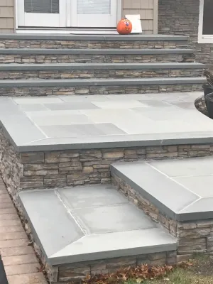 Driveway with Paver Border, Stone Veneer and Blue Stone Treads by Joseph Matthew Landscape Inc Design & Build