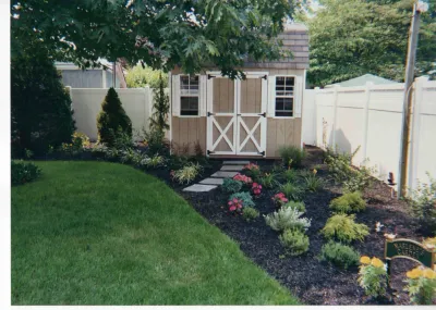Landscape Design and planting with; evergreens, perennials and annuals. by Joseph Matthew Landscape Inc Design & Build