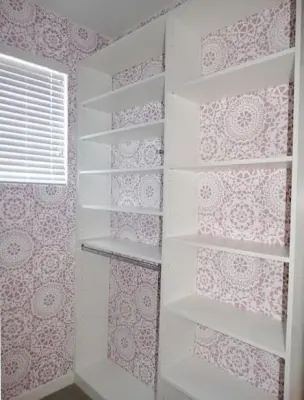 Coastal Cottage Closet with Whimsical Wallpaper Backing — Professional Home Organizers project by Closet Solutions