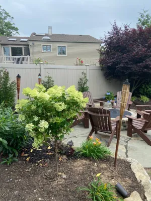 Separate gathering area for friends with Nicolock fire pit — Landscape Construction project by Joseph Matthew Landscape Inc Design & Build in Merrick