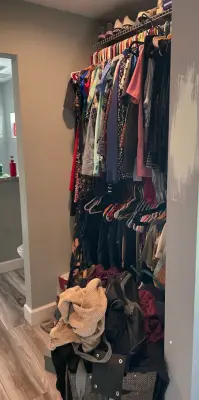 Main Walk-In Closet Arrangement — Professional Home Organizers project by Neat Nathalie & Co LLC