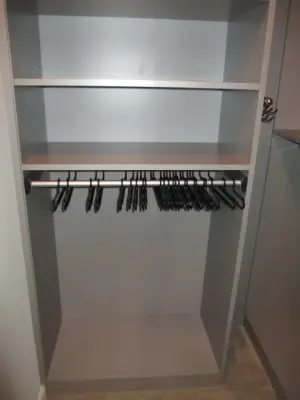 Contemporary Gray Walk-in Wardrobe — Professional Home Organizers project by Closet Solutions