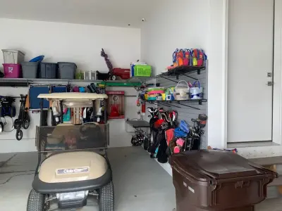 Ape Ladders/Grey Slat Panel — Professional Home Organizers project by Classic Garage Solutions