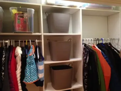 Seasonal storage and craft space (hall closet) — Professional Home Organizers project by Synchronized Spaces