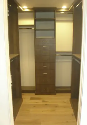 Wood-Enhanced Walk-in — Professional Home Organizers project by Closet Solutions