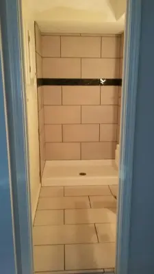 Shower Tiles — Handyman Services project by Benchmark Property Remodeling