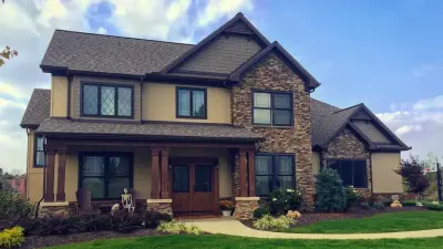 Craftsman Farmhouse in Stone and Stucco — Architectural & Building Design Services project by Green Team Design, Inc.