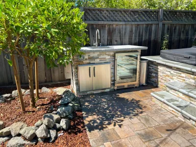 Backyard Oasis with 3D Design: Kitchen, Jacuzzi, Lighting, Pavers, and Shower! by San Jose Tree Service & Landscaping