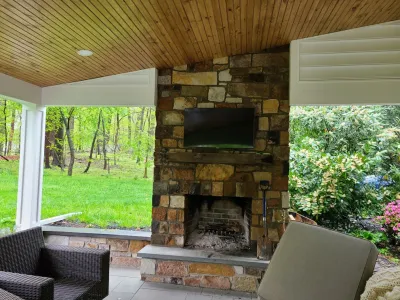 Covered porch and fireplace — Landscape Construction project by Vintage Landscaping in Malvern