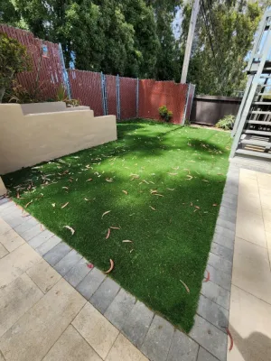 Backyard redo: artifical turf and pavers by Westcoast Hardscape