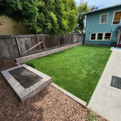 Artifical turf and retaining wall project by Westcoast Hardscape
