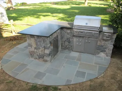 Annapolis Outdoor Kitchen and Patio by Honeysuckle Nursery & Design