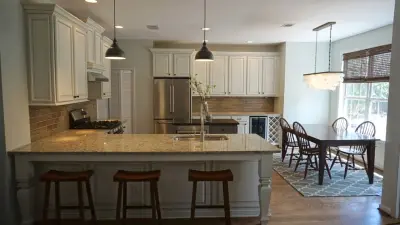 Transitional Oak Kitchen Renovation by Interiors By Abraham
