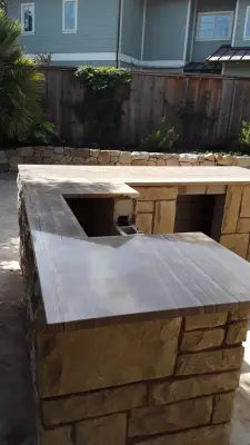Patio with Flagstone and Outdoor BBQ — Kitchen Remodeling project by Sergio Garcia Marble And Tile, Inc.
