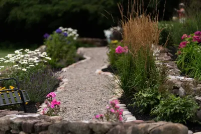Showcase front landscaping with terraces — Landscape Design project by Aureli Landscaping & Custom Stone Work
