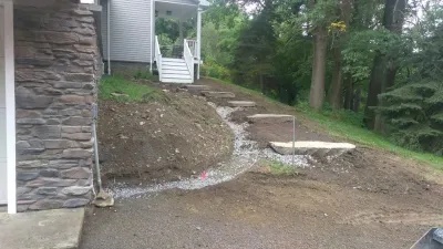 lake house landscape by Aureli Landscaping & Custom Stone Work