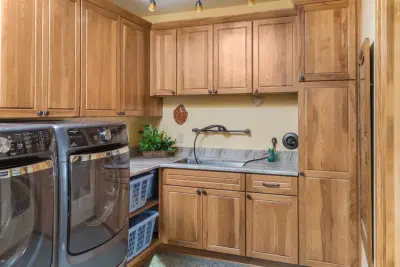 Laundry Room at River Retreat by Creative Kitchen Designs, Inc.