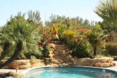 Stone Landscape Rock Border Walls by Broward Landscape, Inc.