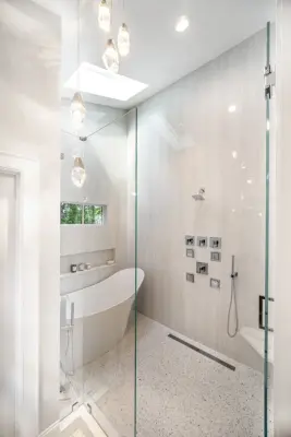 Jewels of the Shower Primary Bathroom by DreamStyle Kitchens & Baths, LLC