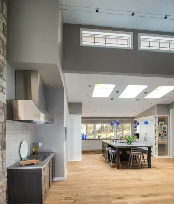 Inclined Ceiling Kitchen and Den by Adam Gibson Design