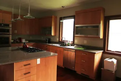 Soft Maple and Butternut Kitchen & Bar with Tailored Millwork — Kitchen Remodeling project by Pearl City Wood Products