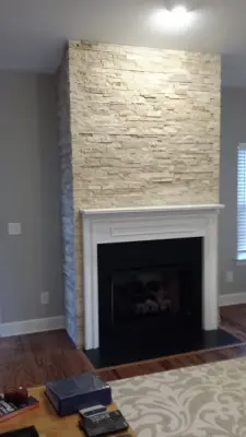 Modern Stone Hearth by Third Generation Renovation