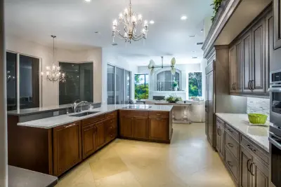 Dual-Hued Kitchen in Pelican Colony by DaVinci Kitchens, Bath, & Cabinetry