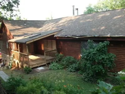 Log Cabin Staining — House Painting Services project by ImageWorks Painting Inc.