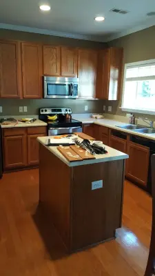 White Painted Oak Cabinets and Island by Wallscapers Kitchen & Bath Innovations