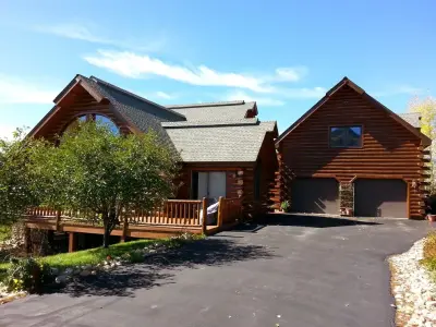 Log Cabin Facade Renovation — House Painting Services project by Flying Z Painting