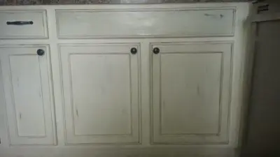 Distressed kitchen cabinets with a painted finish — House Painting Services project by ValHolla LLC