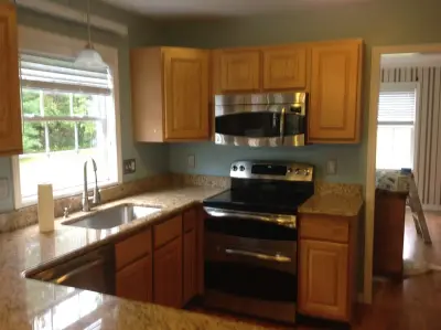Refinished Kitchen Cabinets — House Painting Services project by Linke's Painting To Wallcoverings