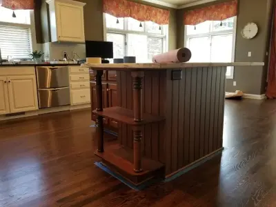 Colored kitchen island by Hometerior Finishing, LLC.